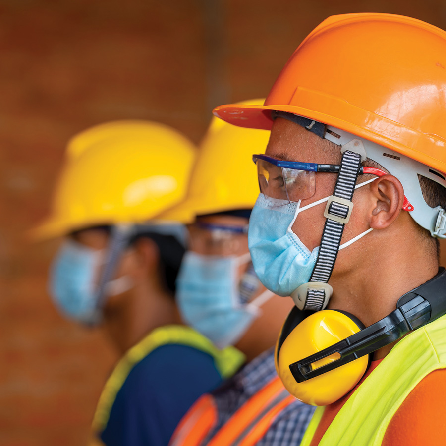 ASTM International workers wearing safety vests and helmets
